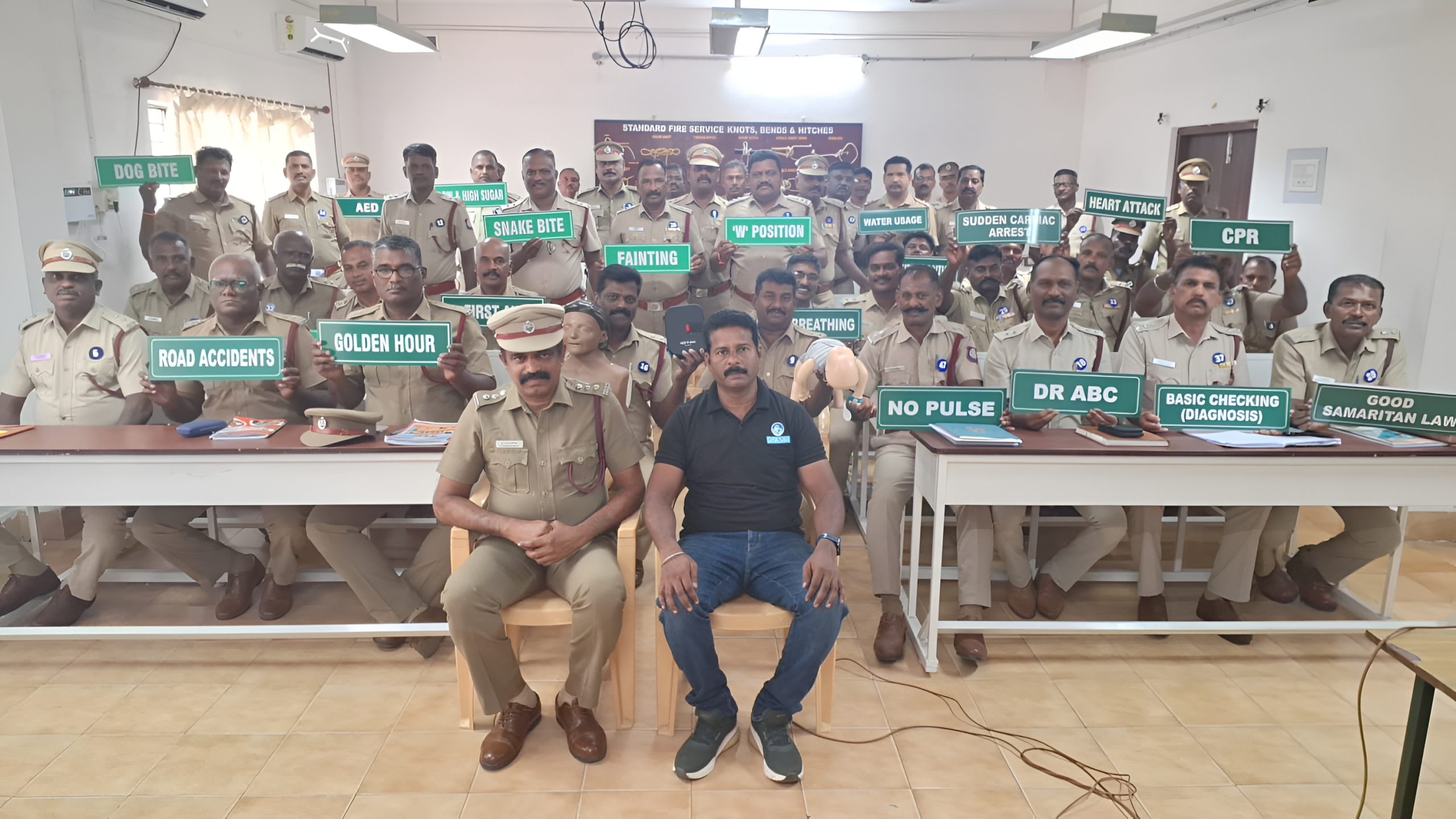 Tamil Nadu Fire and Rescue Services officers attending Raksha NGO first aid, CPR, and emergency response training program on lifesaving skills and community safety.